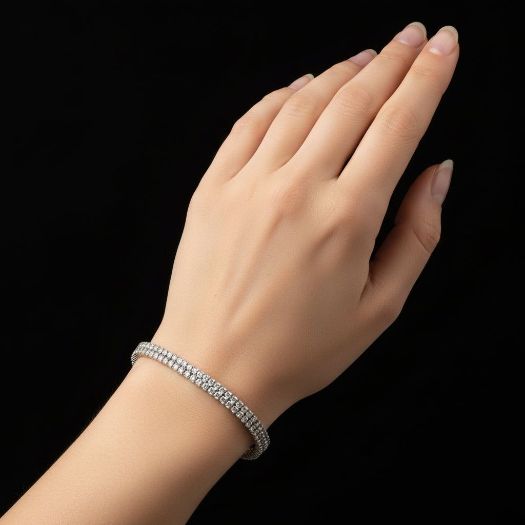 Silver bracelet with clear stones on a black background