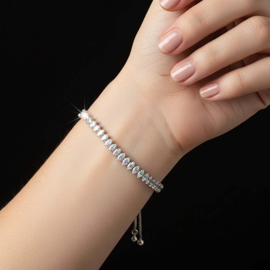 Silver beaded bracelet on a black background