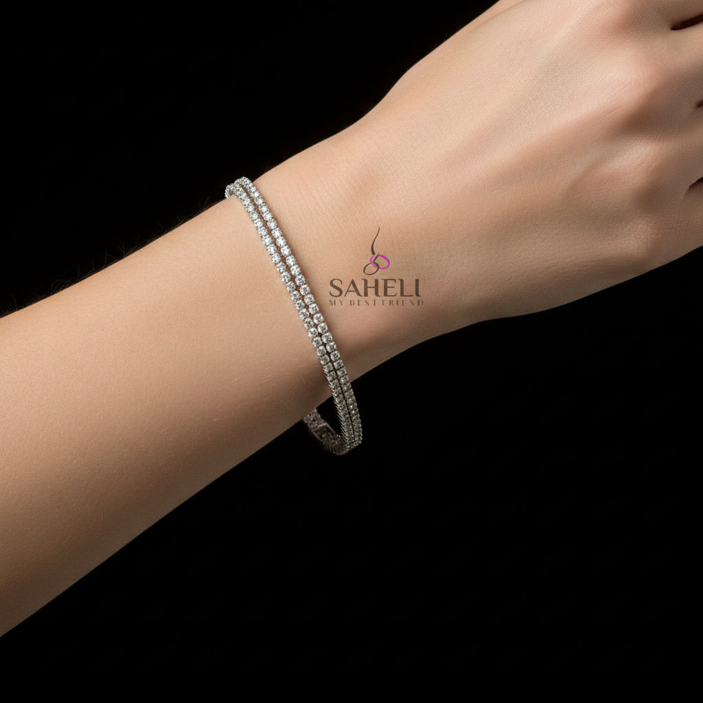 Silver bracelet on a dark background with 'SAHELI' branding.