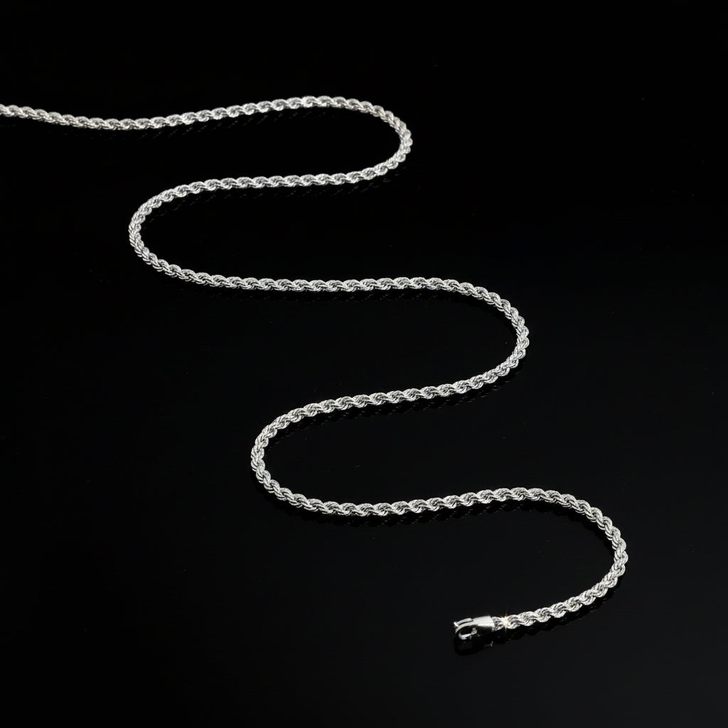 Silver chain necklace on a dark gray background
