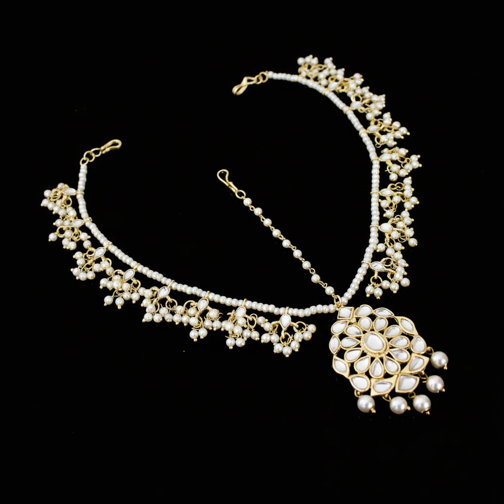 Delicate necklace with floral design on a dark background, featuring the brand 'Saheli'.