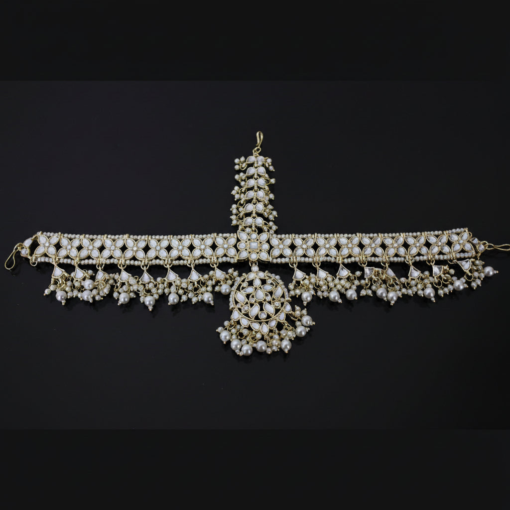 Decorative necklace with pearls on a dark background, branded 'Saheli'.