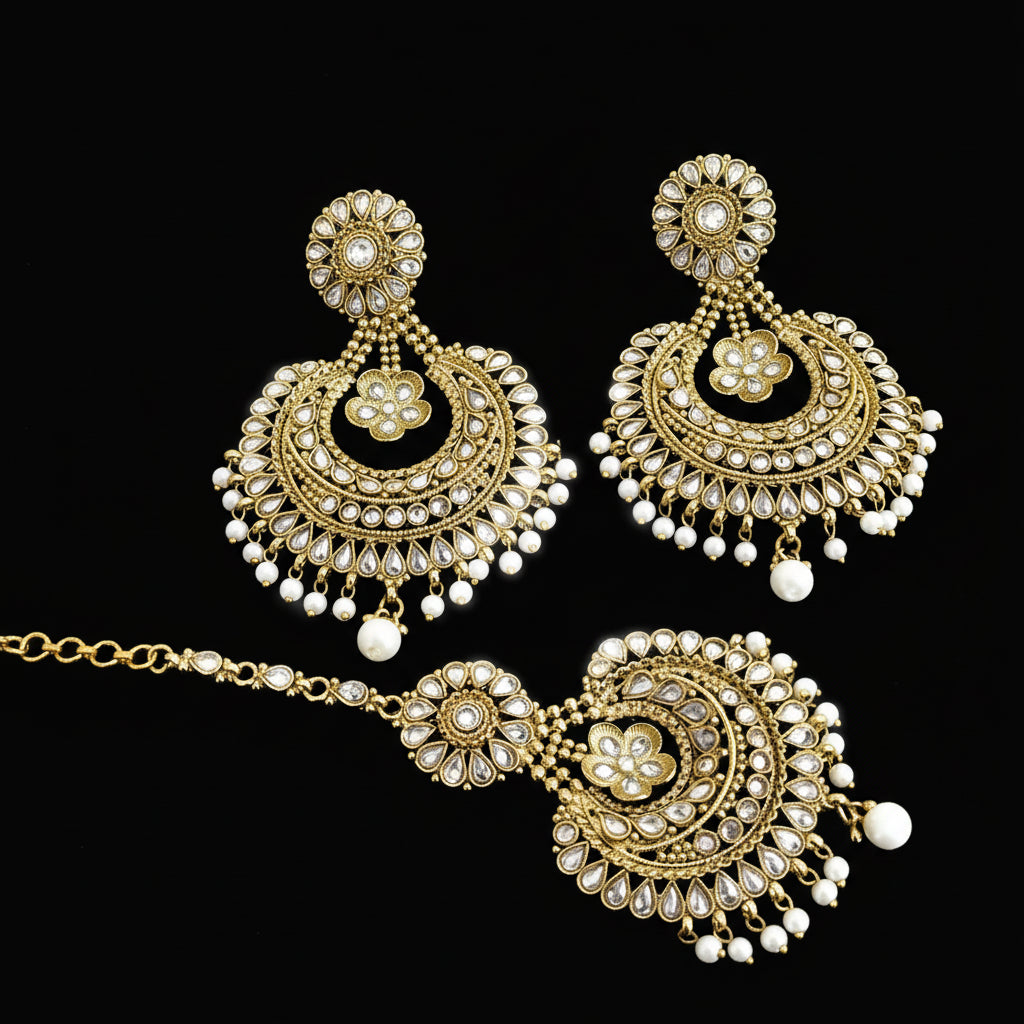 Ornate gold and pearl necklace and earrings set on a dark background with 'Saheli' branding.