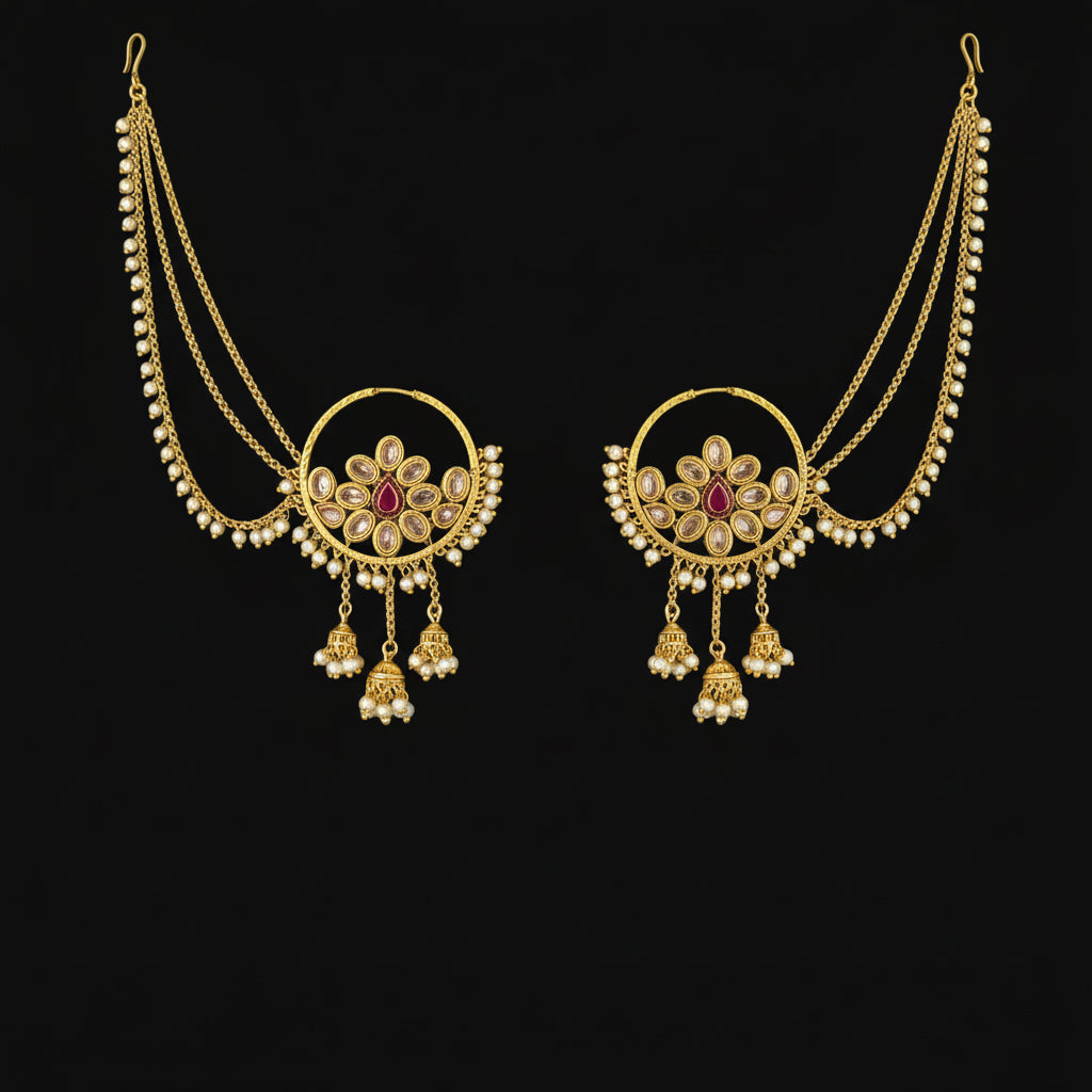 Gold necklace with red gemstones on a gray background, featuring the brand 'Saheli'.