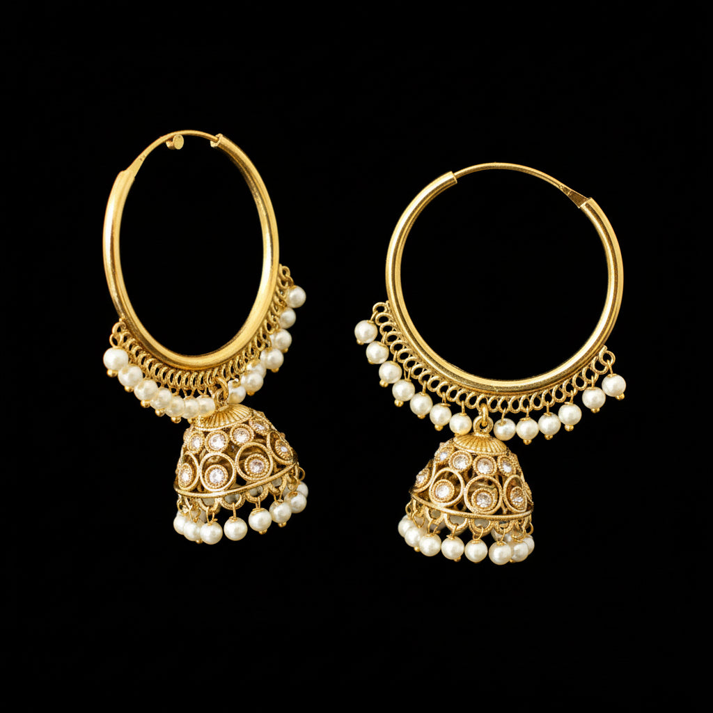 Gold hoop earrings with pearl accents on a black background