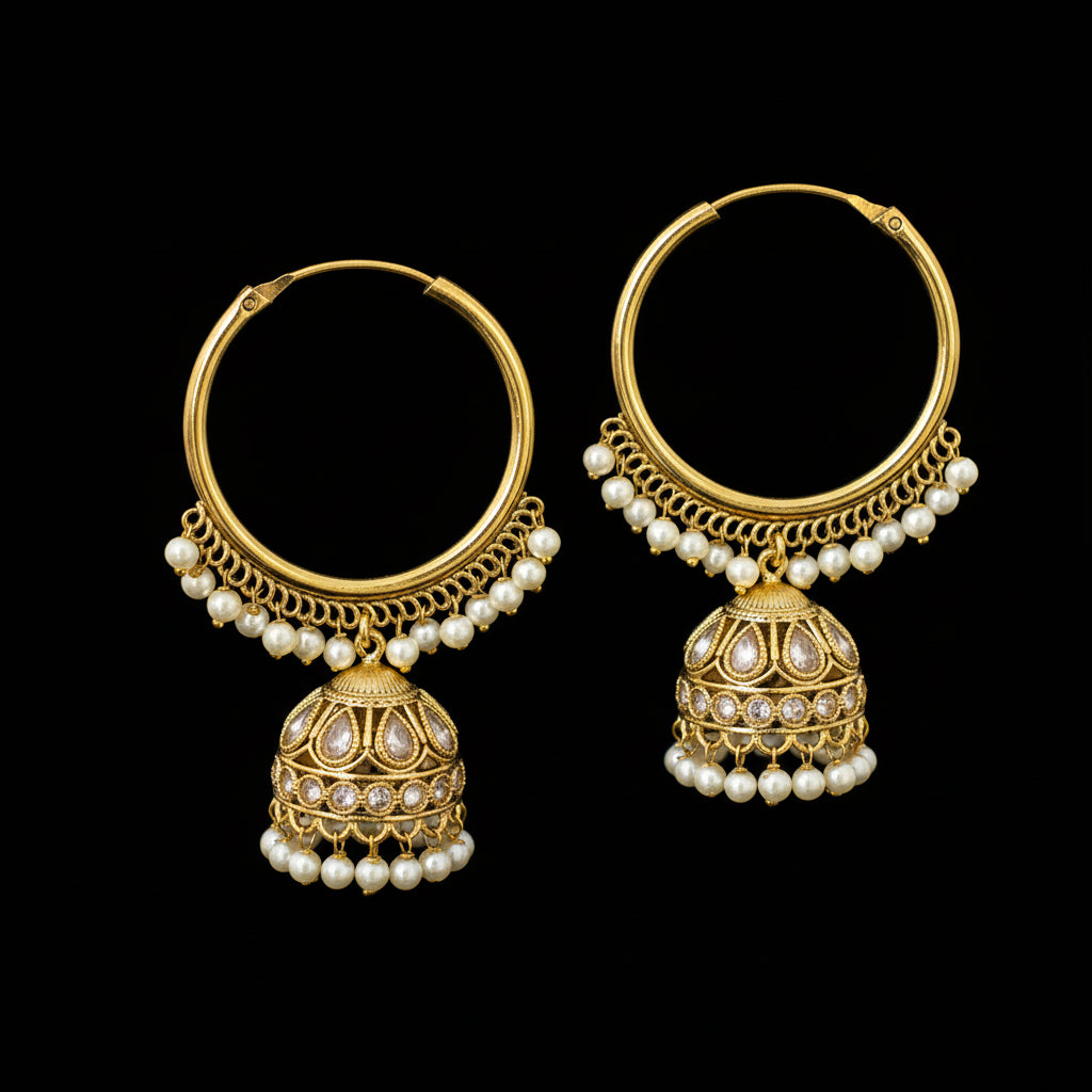 Gold hoop earrings with pearl and gemstone details on a black background