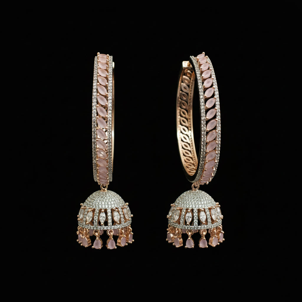 Pair of ornate earrings on a black stand against a gray background