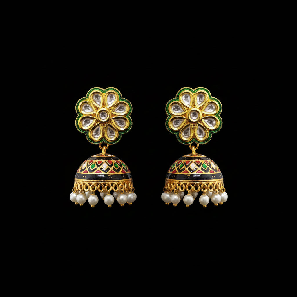 Ornate gold and green earrings with pearl accents on a gray background, featuring the brand 'SAHELI'.
