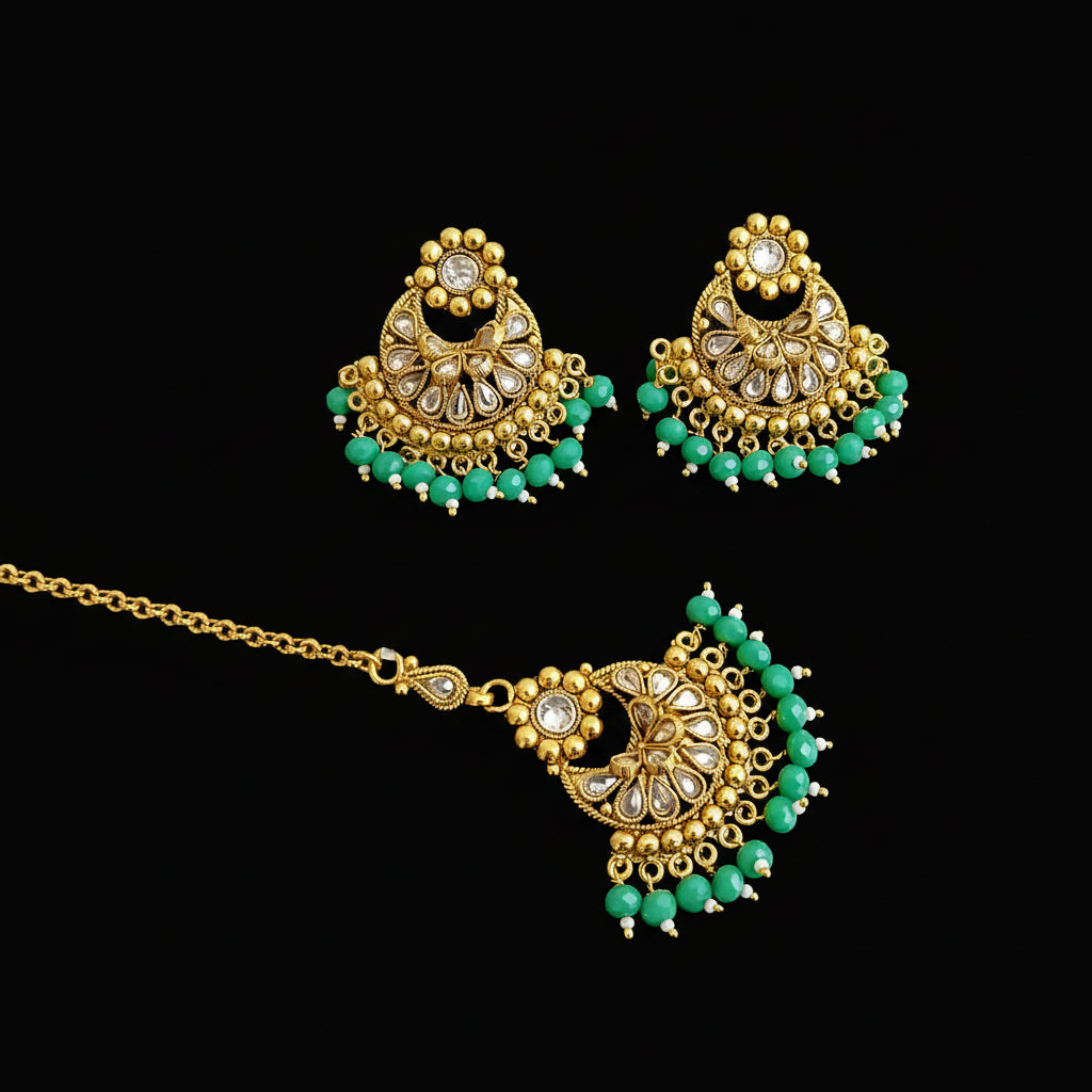 Gold and green jewelry set on a dark background with 'SAHELI' branding.