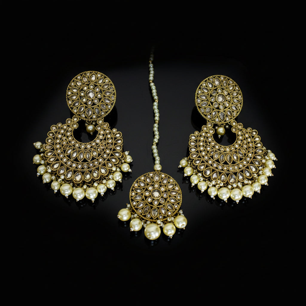 Gold and pearl earrings on a dark background with 'Saheli' branding.