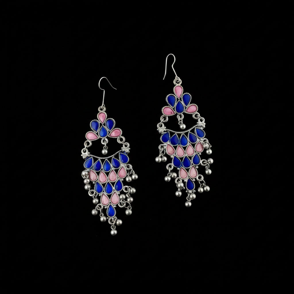 Decorative earrings with blue and pink stones on a gray background, branded 'SAHELI'.
