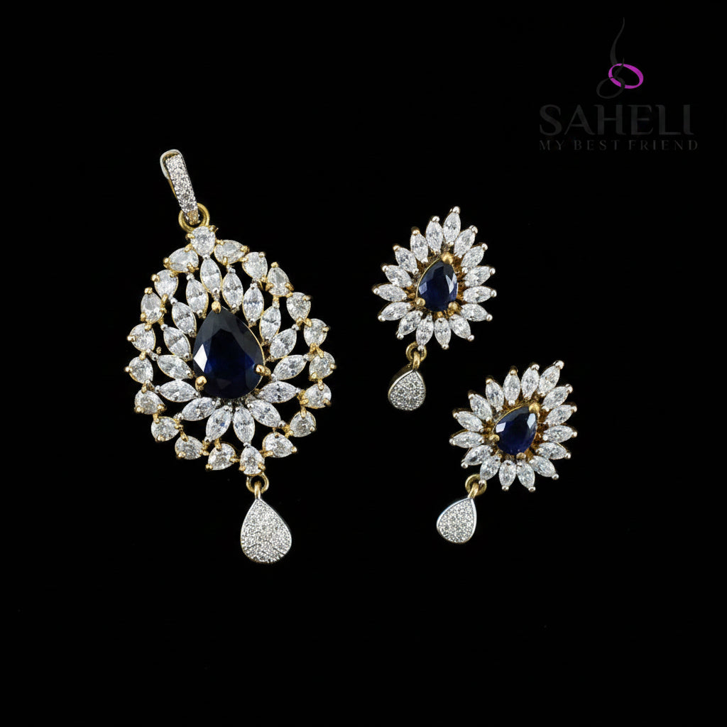 Diamond jewelry set with pendant and earrings on a dark background, featuring the brand 'Saheli'.