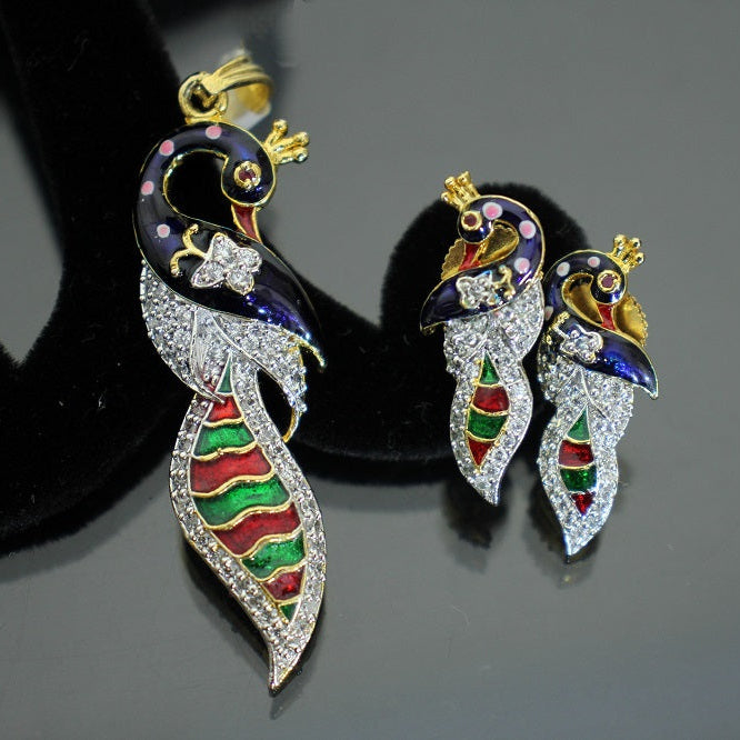 Colorful peacock-shaped earrings on a dark background with 'SAHELI' branding.