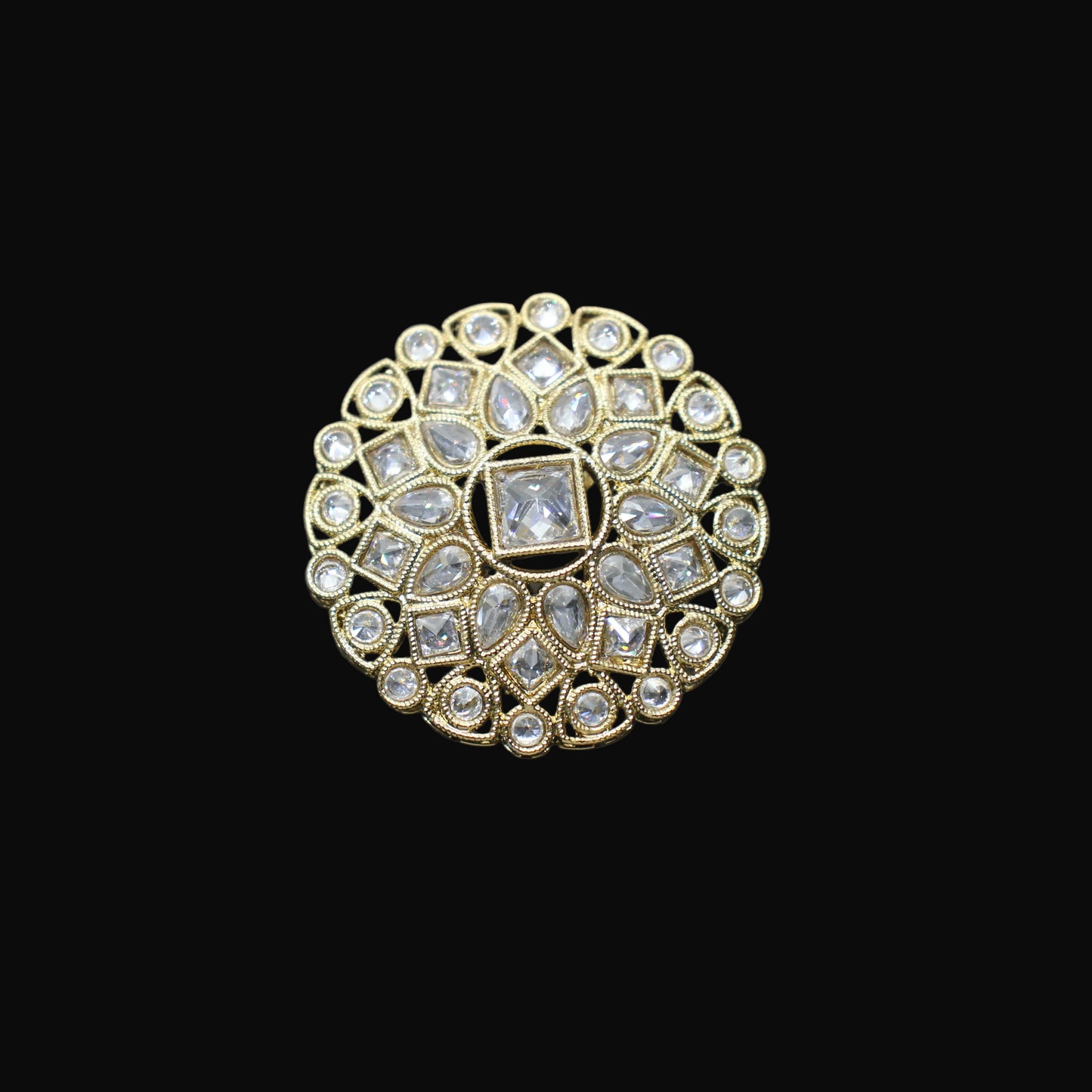 Decorative ring with gemstones on a black mannequin hand