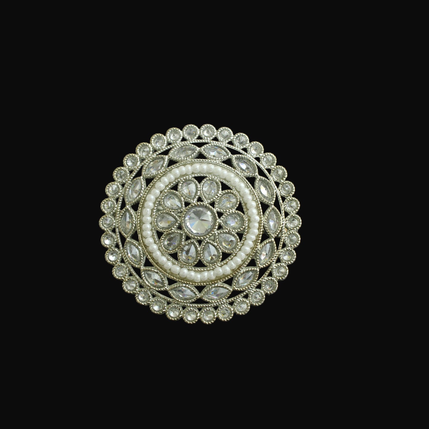 Decorative circular object with intricate design on a black background