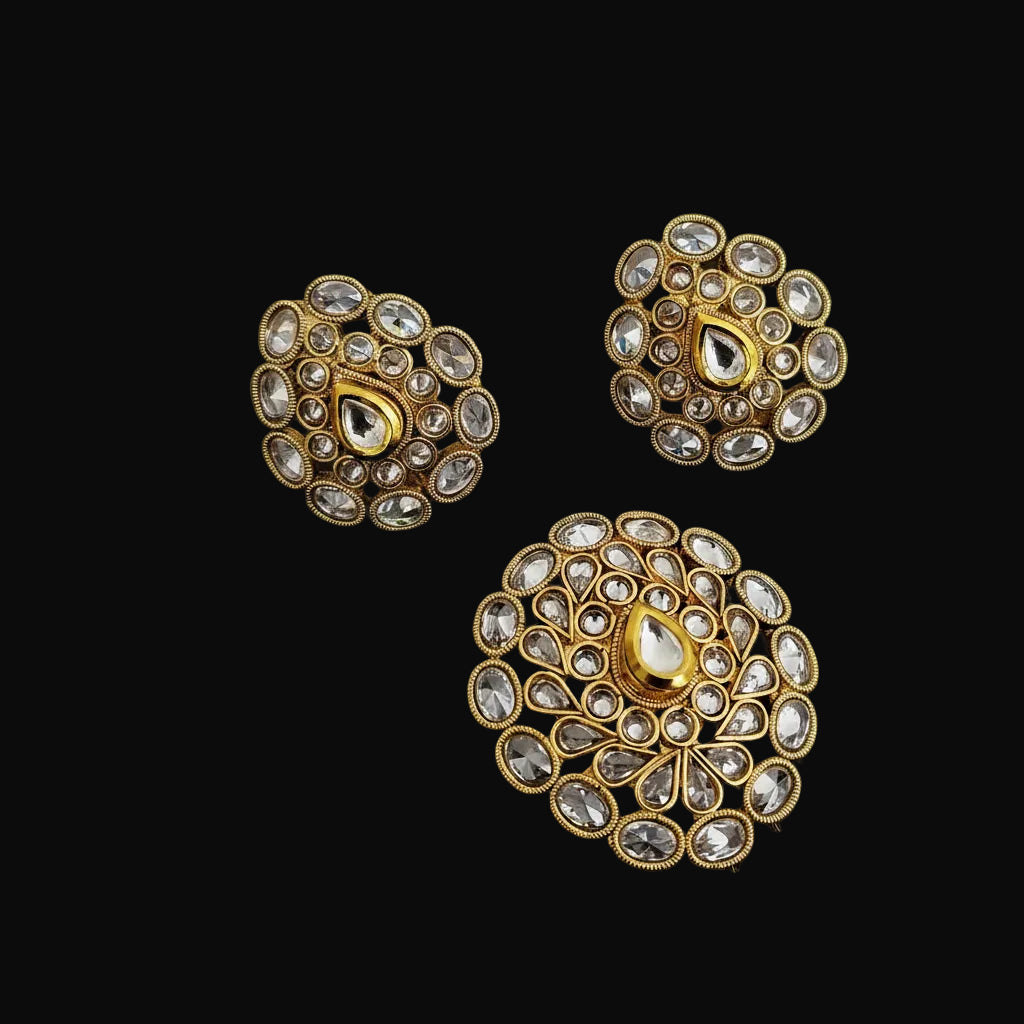 Gold and diamond earrings on a dark background with 'Saheeli' branding.