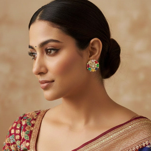 Woman in a colorful saree with a decorative background