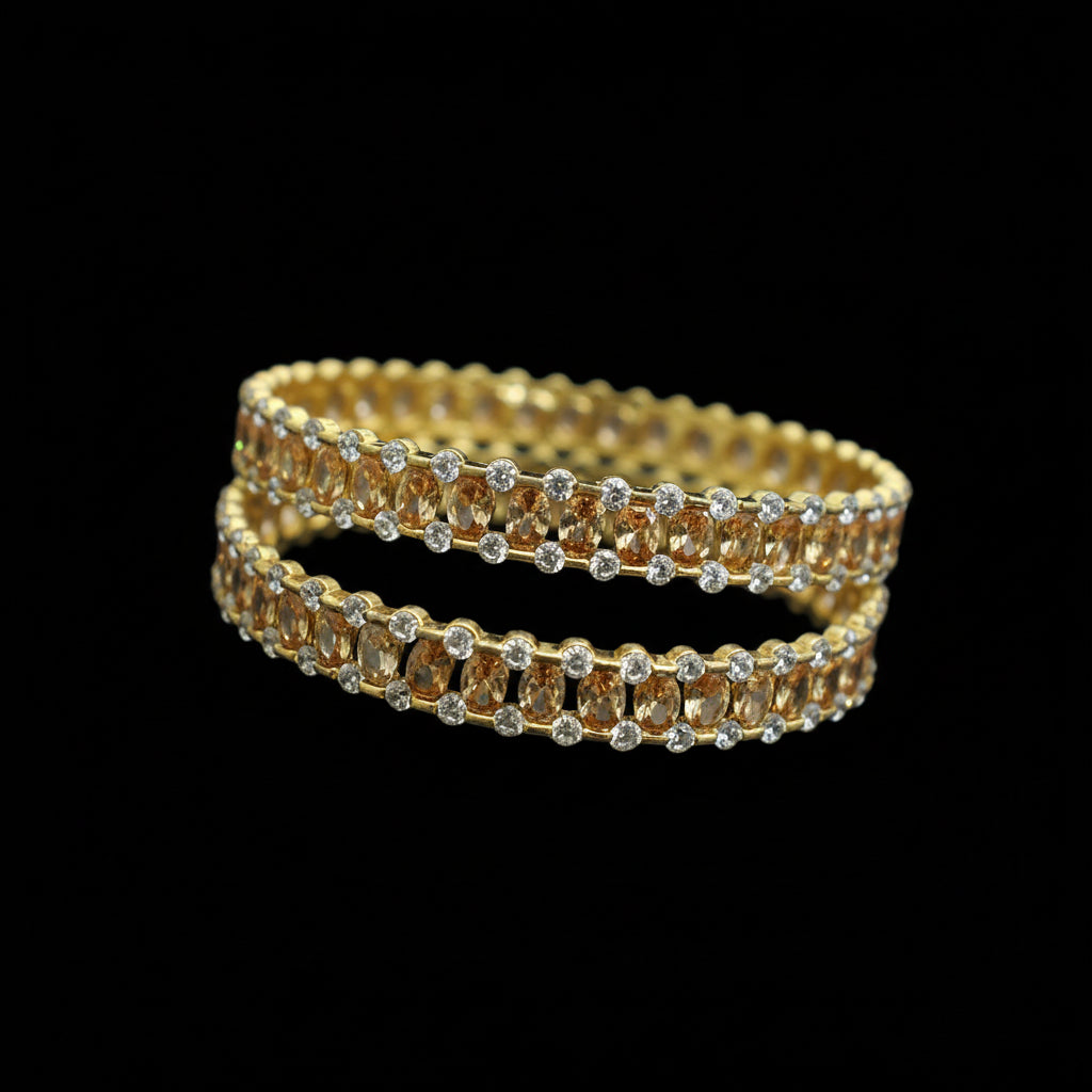 Gold and amber beaded bracelet on a black stand with 'Saheli' branding.