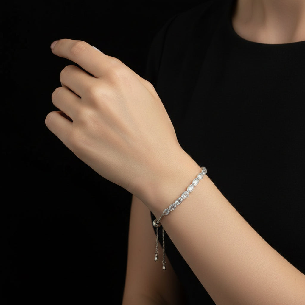 Silver bracelet with clear stones on a dark background