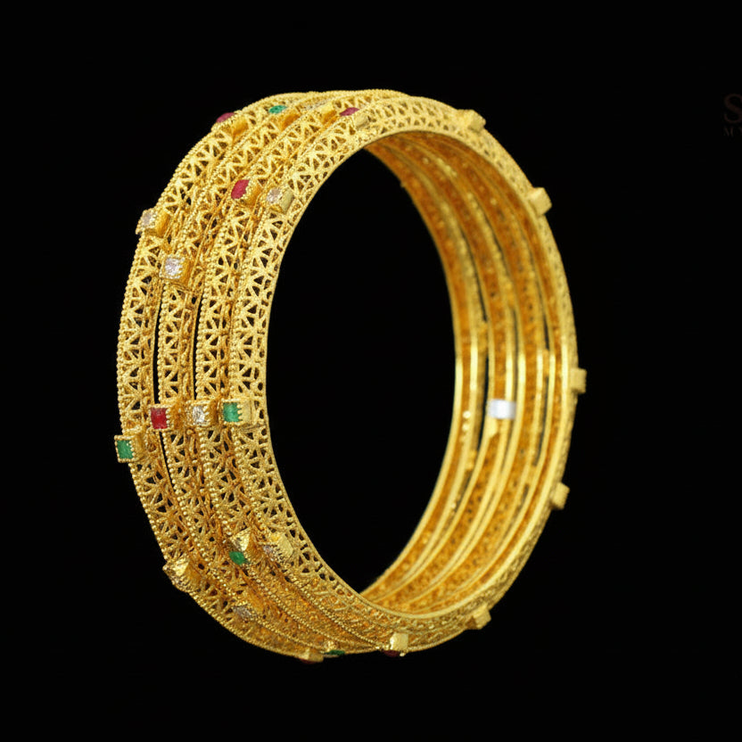 Gold bangles with embedded stones on a gray background, featuring the brand 'Saheli'.