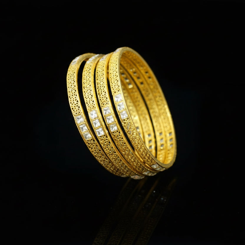 Gold bangles on a stand with 'SAHELL' branding on a gray background