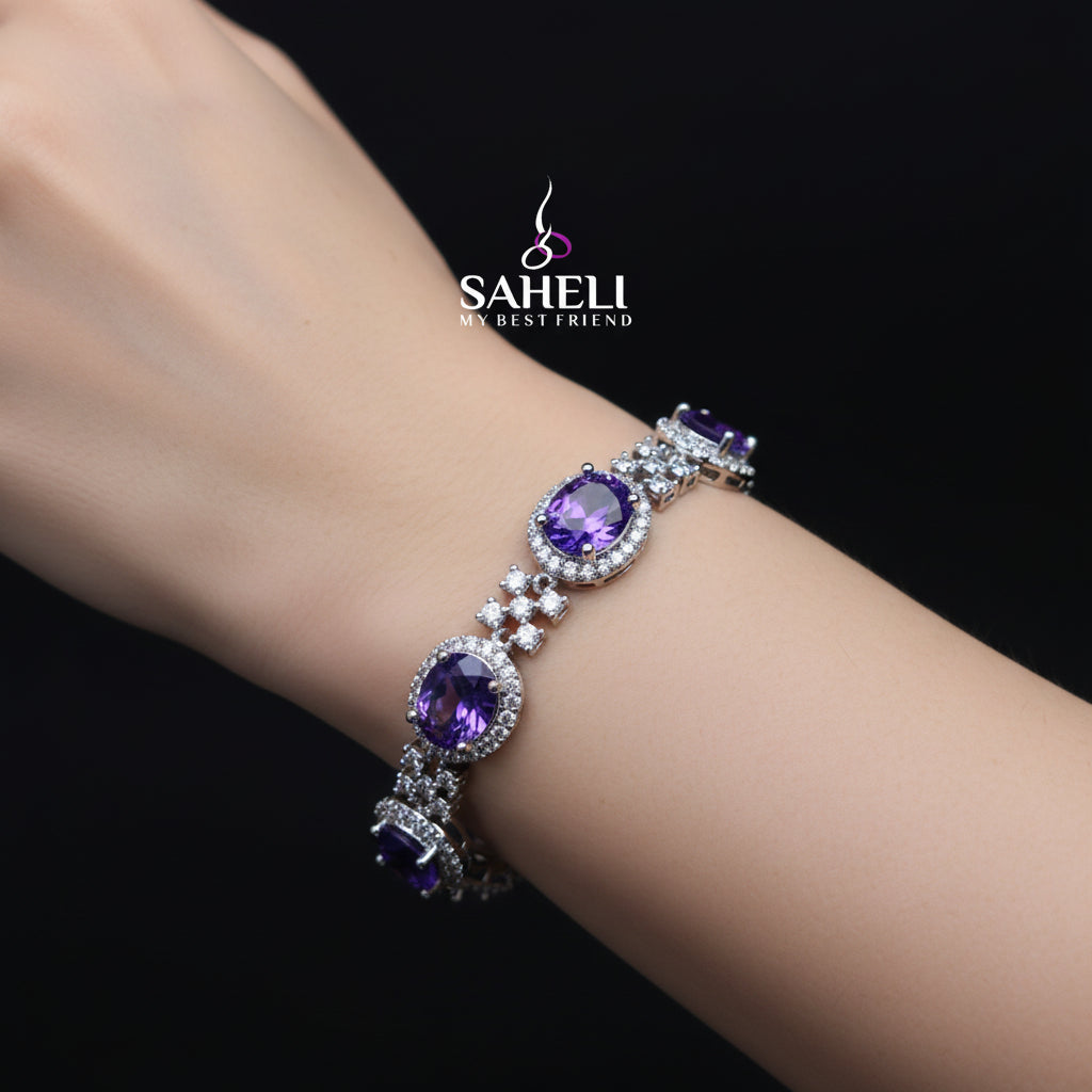 Jewelry necklace with purple stones on a black stand, featuring the brand 'Saheli'.