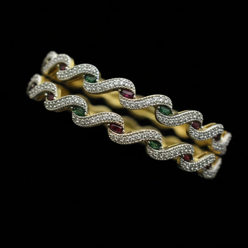 Gold chain bracelet on a black stand with 'SAHELI' branding.