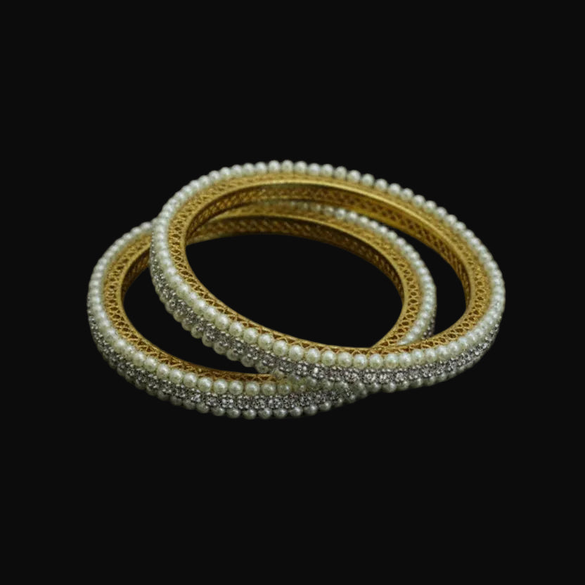 Pearl and crystal bangles on a black mannequin with 'SAHELI' branding.