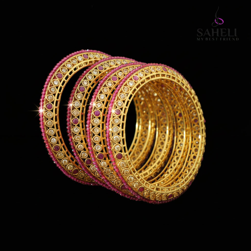 Set of gold and pink bangles on a gray background with 'SAHELI' branding.
