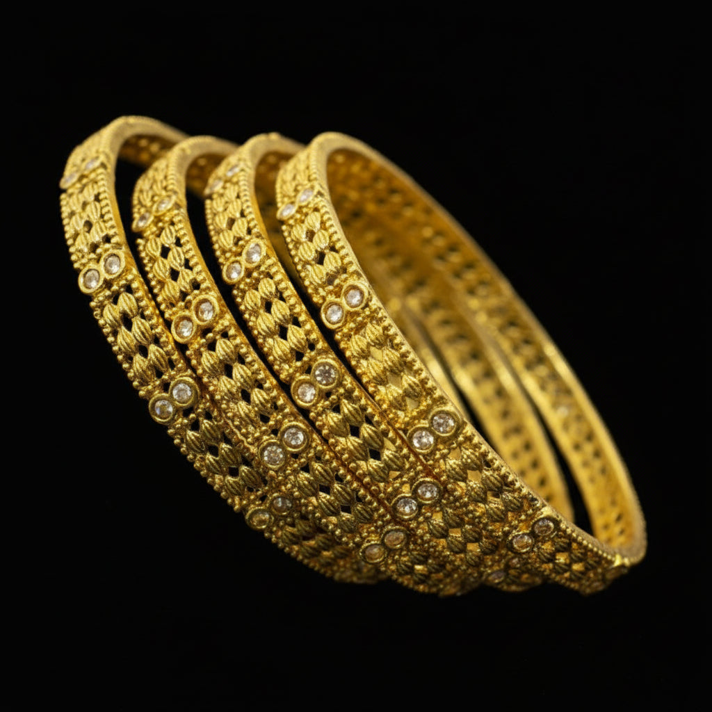 Set of gold bangles with 'Saheli' branding on a dark background