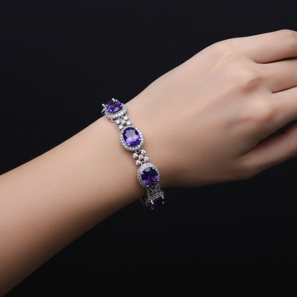 Jewelry necklace with purple stones on a black stand, featuring the brand 'Saheli'.
