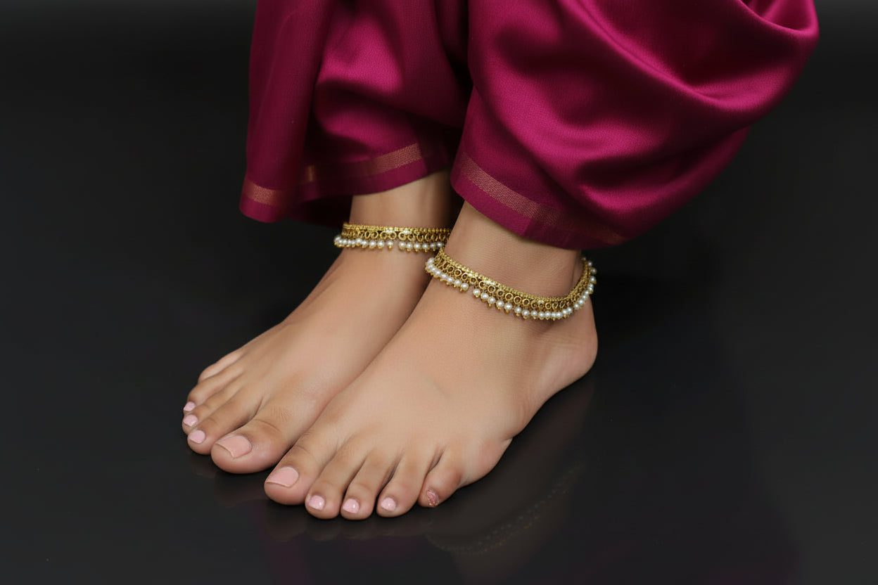Gold necklace with pearls on a dark background