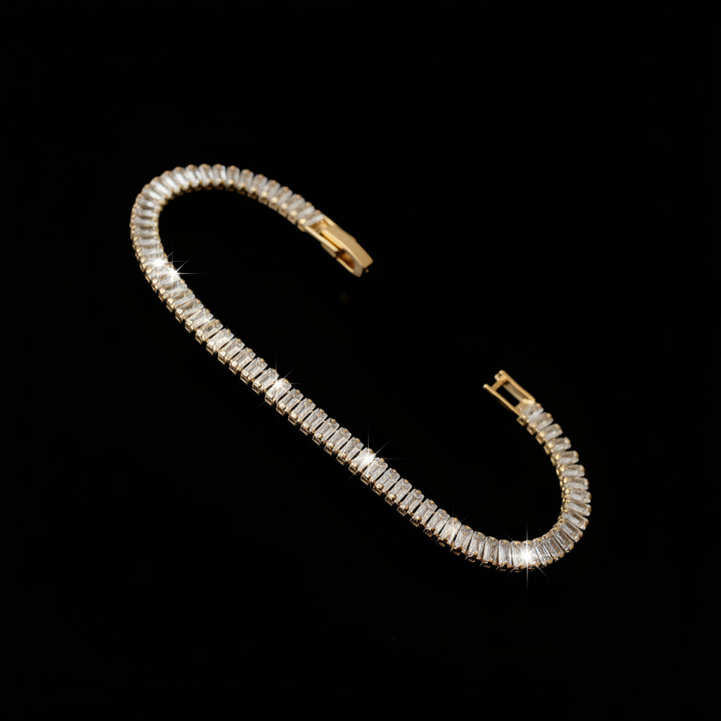 Gold bracelet with diamond accents on a dark reflective surface