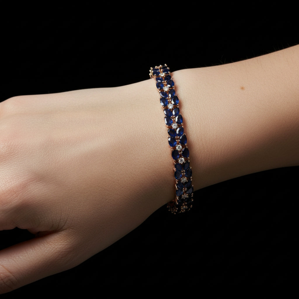 Bracelet with blue stones and gold accents on a dark background