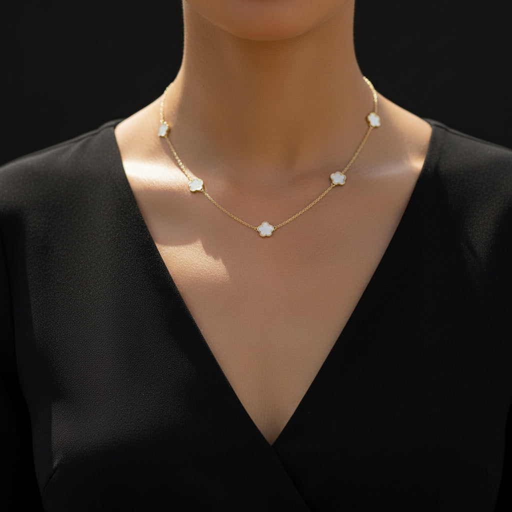 Necklace with floral pendants on a dark background