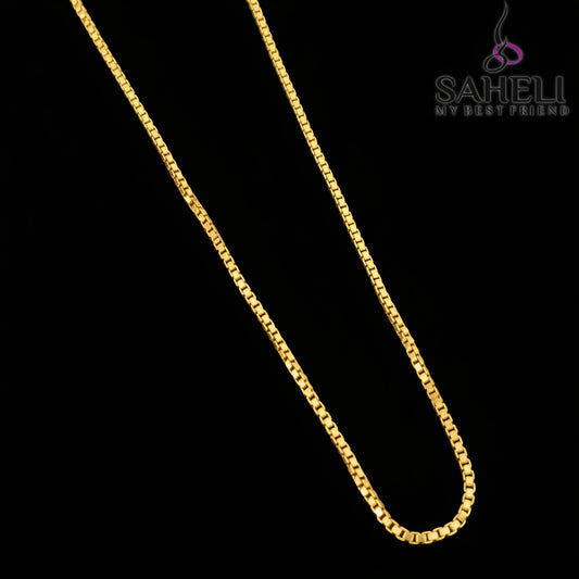 Gold chain necklace on a gray background with 'SAHELI' branding.