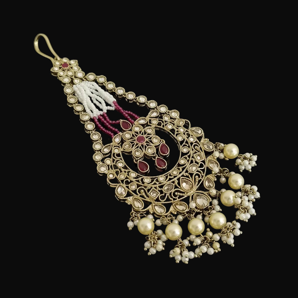 Decorative hanging ornament with intricate design on a black background