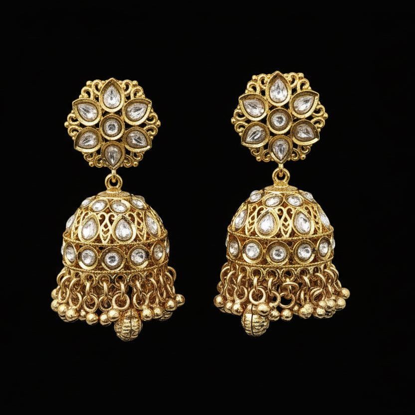 Gold earrings with intricate designs on a black stand, branded 'S琼X'.