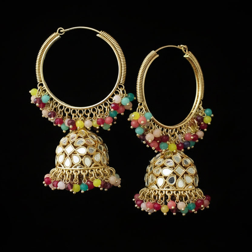 Pair of gold hoop earrings with colorful beads on a black background