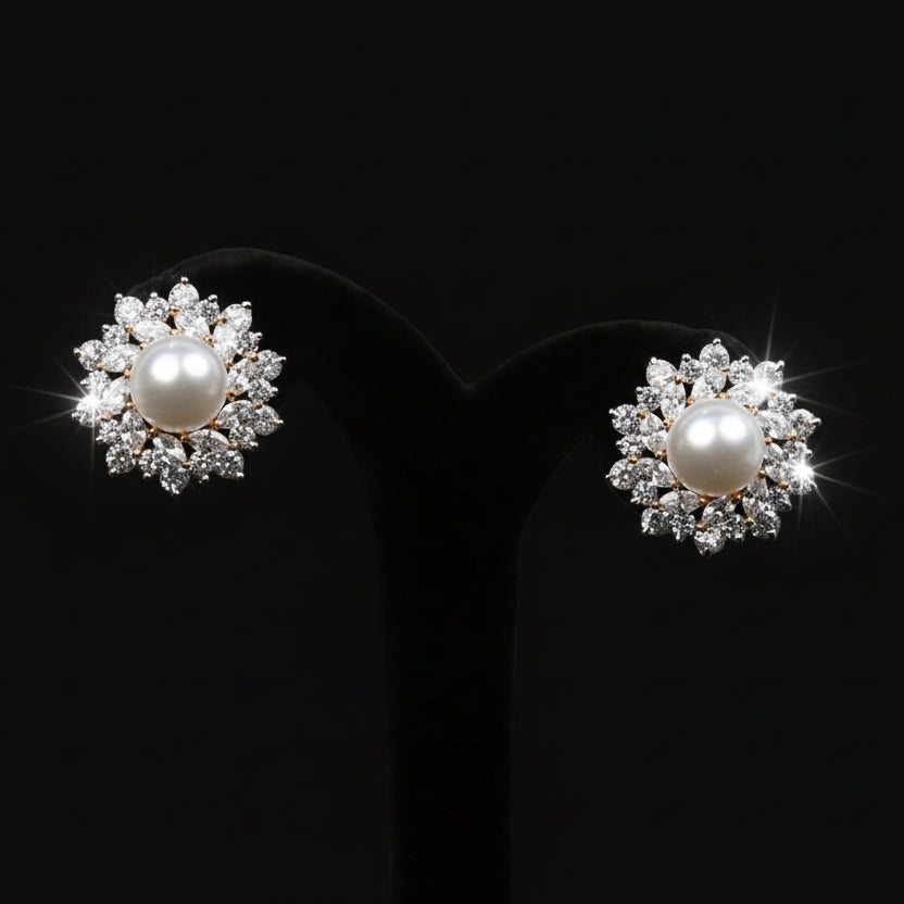 Pearl earrings on a black stand with 'Saheli' branding.