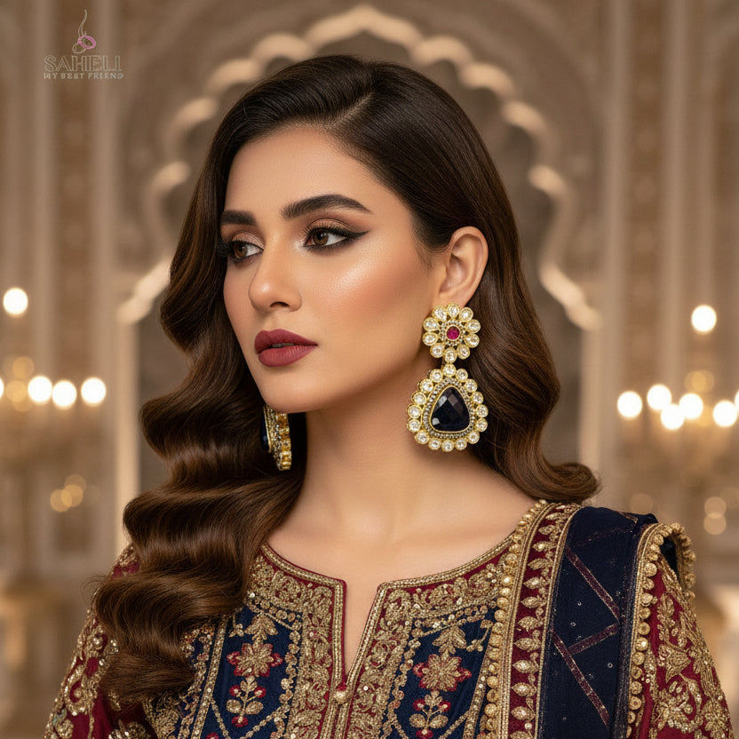 Jewelry set with floral design earrings featuring gemstones on a black background.