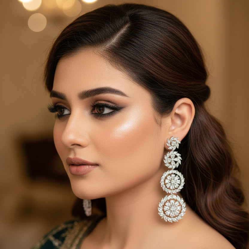 Pair of diamond earrings on a dark background