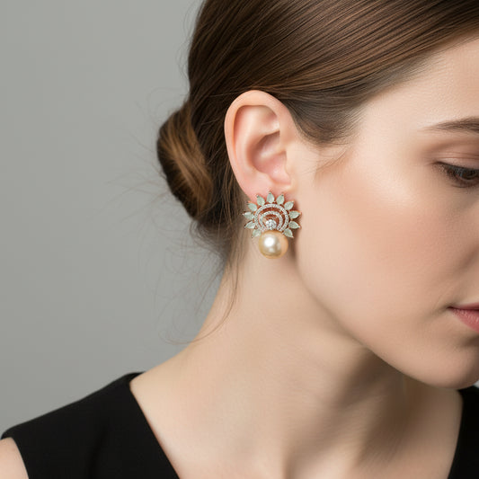Pair of earrings with pearl-like beads and decorative elements on a dark background