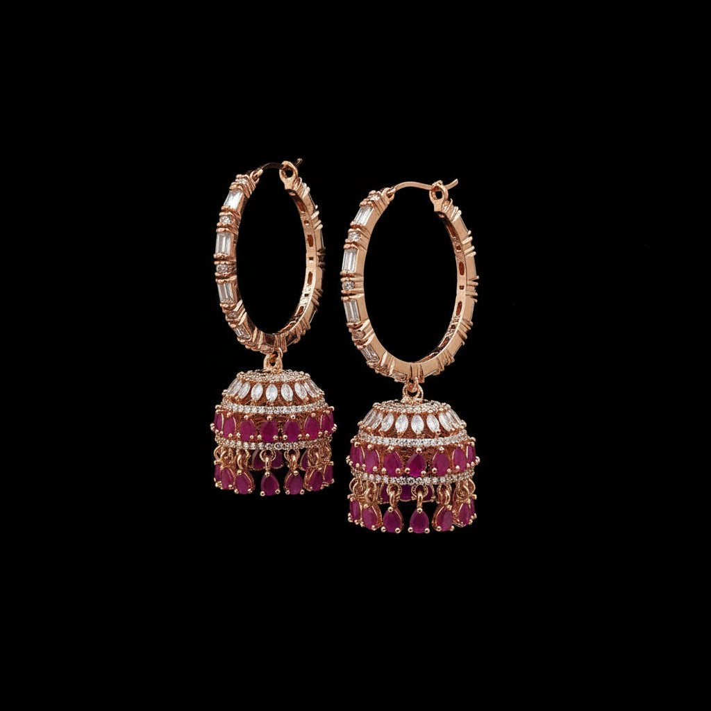 Rose gold and pink gemstone earrings on a black stand with 'SAHELI' branding.