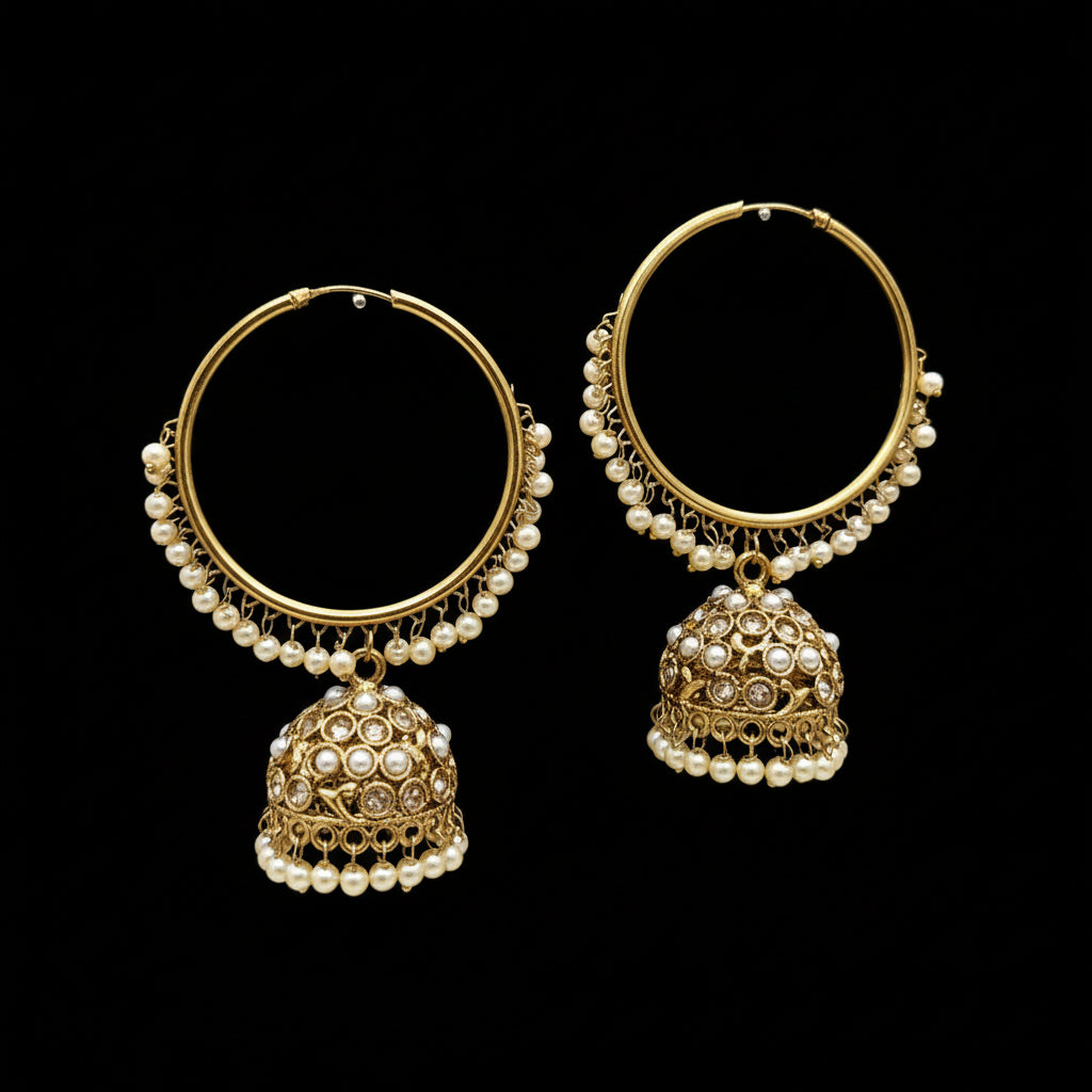 Gold hoop earrings with pearl drops on a gray background, branded 'SAHELI'.