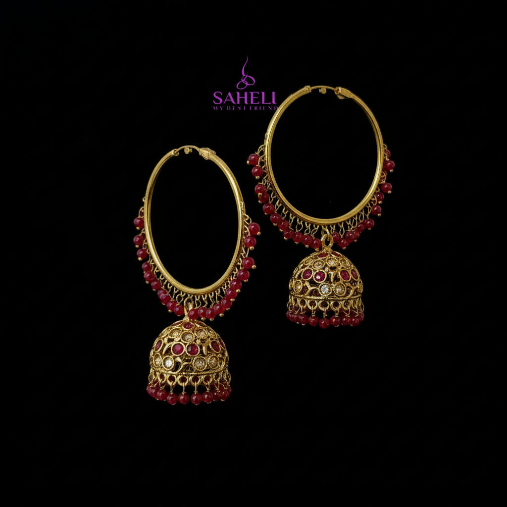 Gold and red earrings on a black background with 'SAHELI' branding.