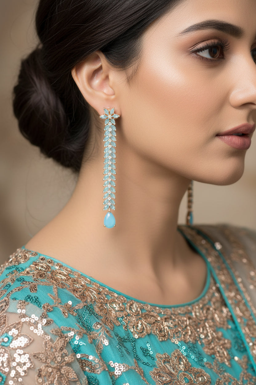 Pair of earrings with blue stones on a dark background