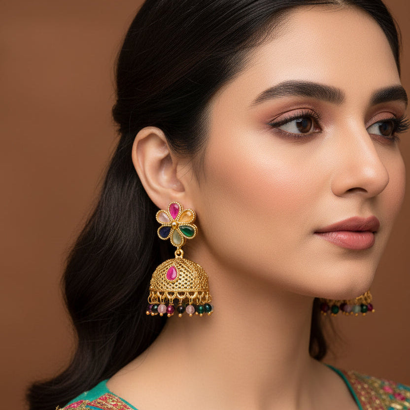 Woman wearing traditional jewelry with a brown background