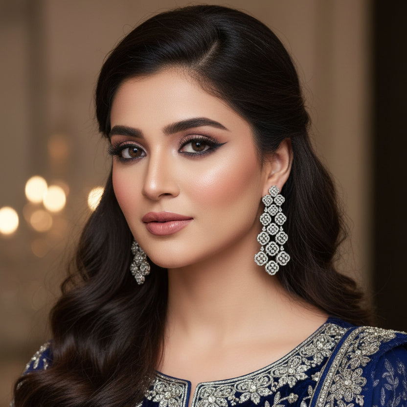Pair of decorative earrings on a dark background