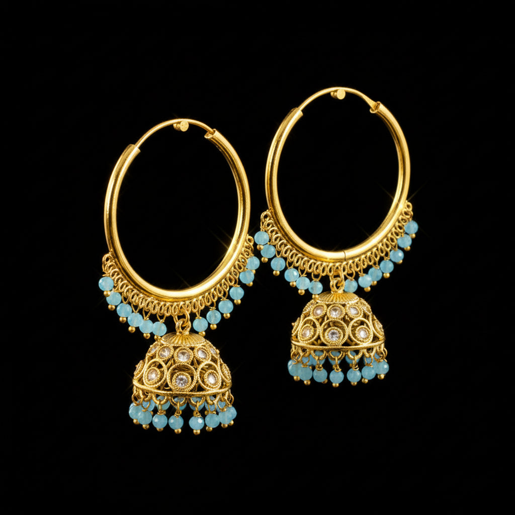 Gold hoop earrings with blue beads on a black background
